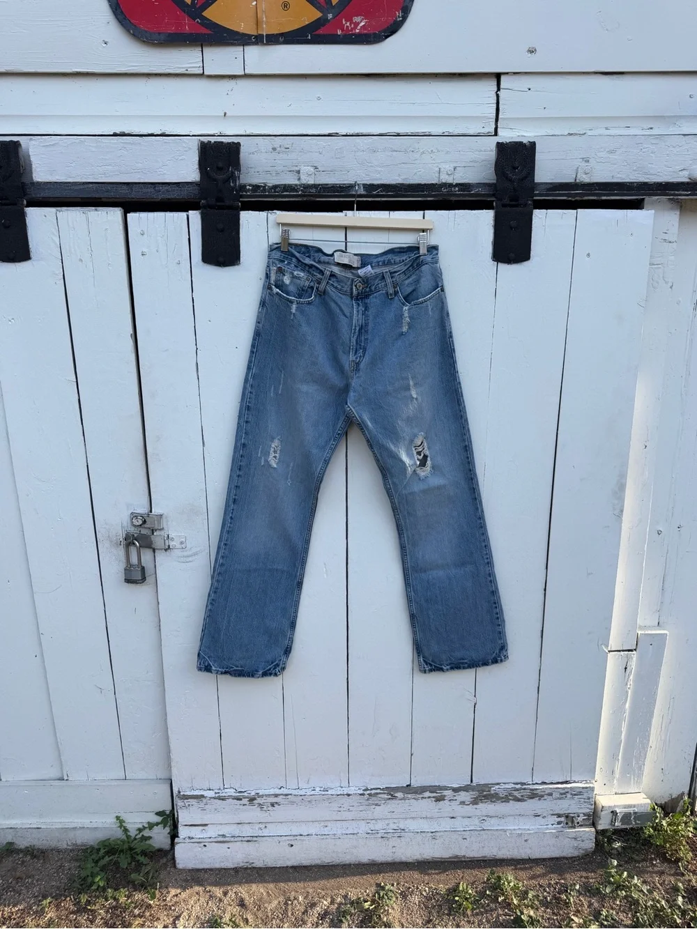 Levi's Medium Blue Bootcut Jeans with Distressed Hem